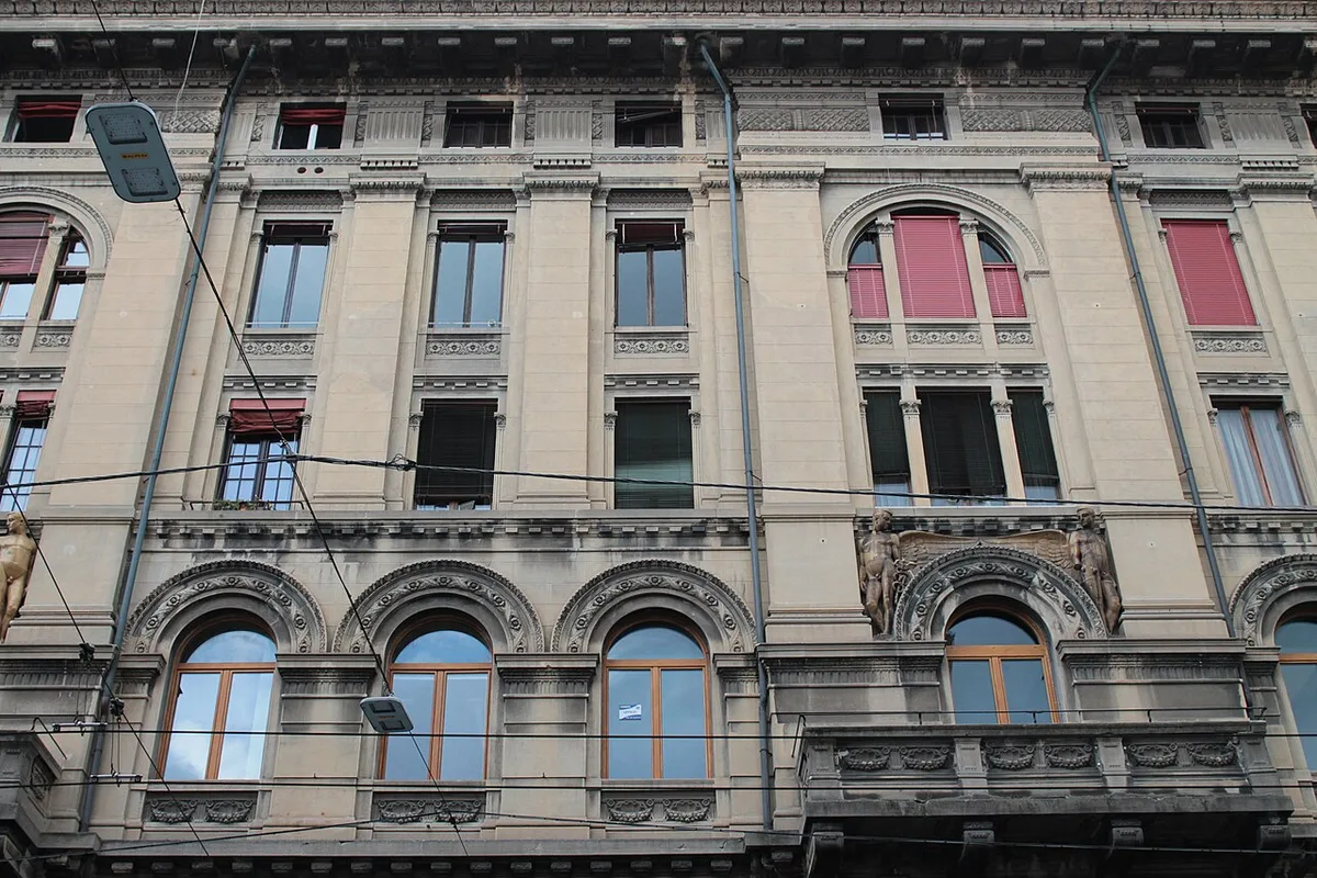 Historic building and street lighting in central Bologna