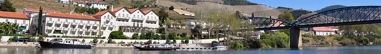 Panorama of Pinhão's riverfront and bridge beside the Douro