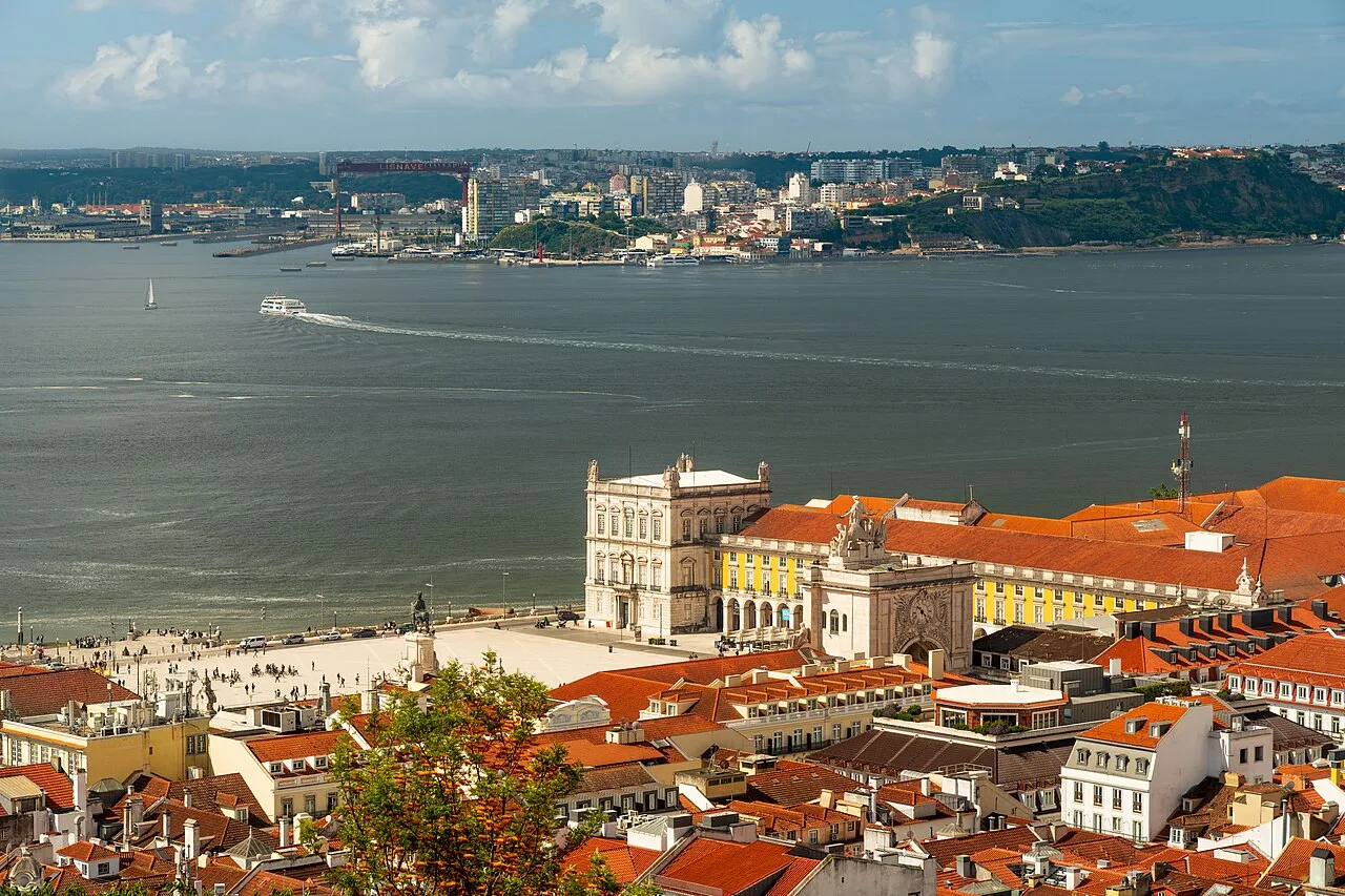 Praça do Comércio and the Tagus viewed over Lisbon rooftops