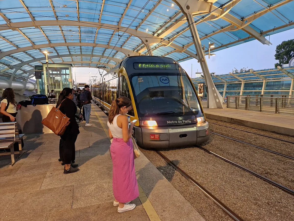 Metro train at the covered outdoor Aeroporto station in Porto
