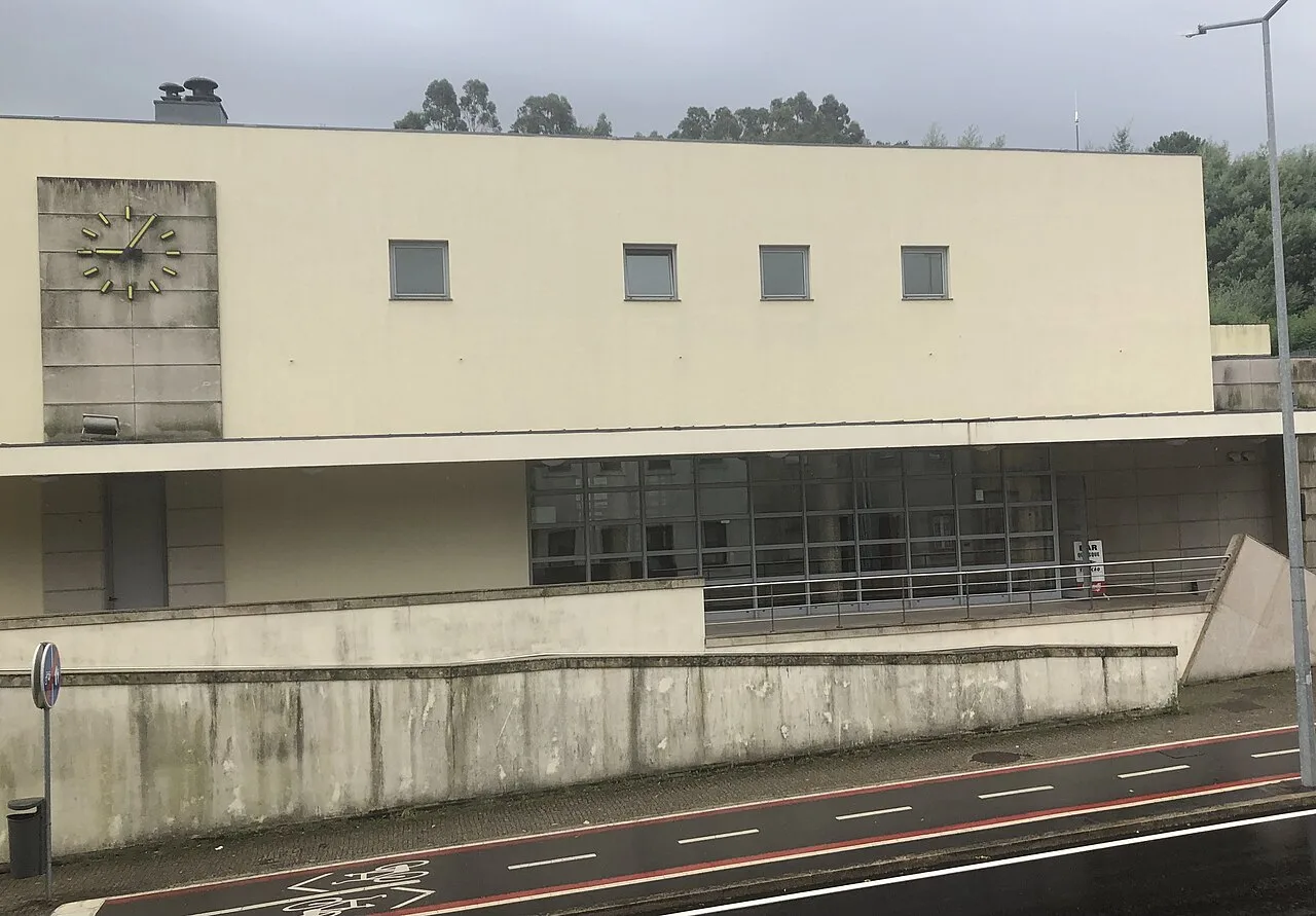 The modern Guimarães railway station building beside the road
