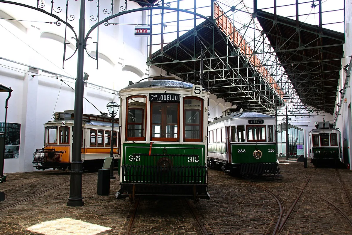 Historic tramcars displayed inside Porto’s Tram Museum