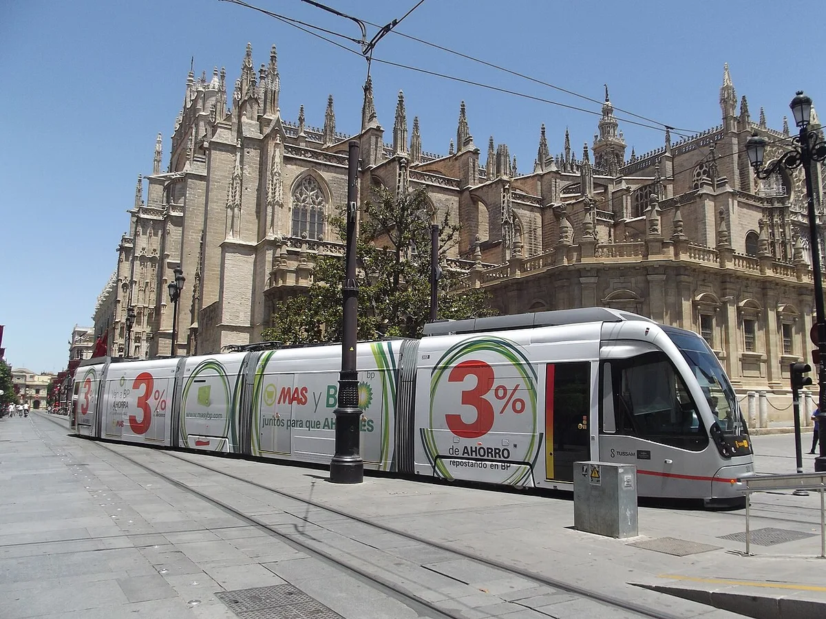 MetroCentro tram beside Seville Cathedral, away from Plaza de Armas