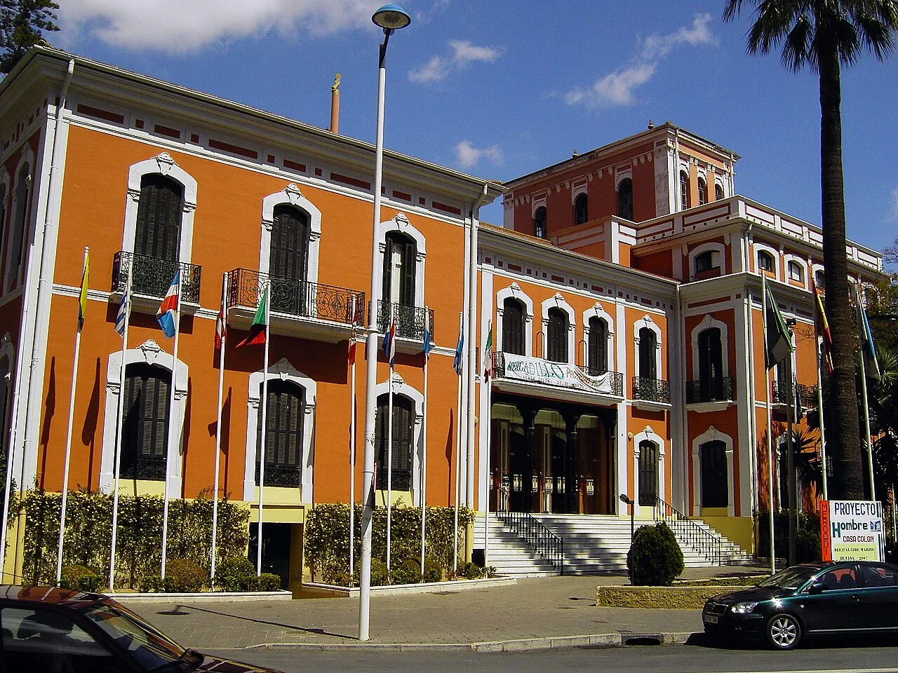 Historic Casa Colón building in Huelva, with its orange and white façade